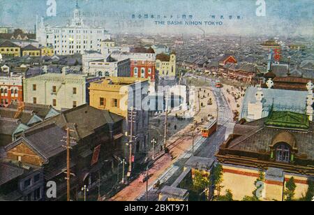 [ 1910s Japan - Nihonbashi Bridge in Tokyo  ] —   Streetcars on Nihonbashi Bridge in Tokyo, designed by Yorinaka Tsumaki (妻木頼黄, 1859-1916).  The white building in the background is the Mitsukoshi Department Store.  During the Edo Period (1600-1867), the bridge was the starting point of the famous Tokaido and the other 4 post roads.  20th century vintage postcard. Stock Photo