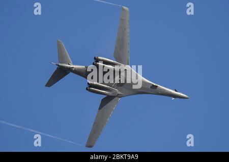 A U.S. Air Force B-1B Lancer stealth bomber, assigned to the 37th Expeditionary Bomb Squadron, flies over Andersen Air Force Base July 26, 2017 in Yigo, Guam. Stock Photo