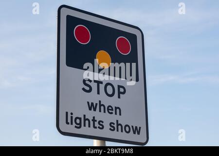 Sign indicating for traffic to stop when lights show for level crossing inBirkenhead Wirral August 2019 Stock Photo