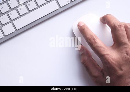 person hand use computer mouse on desk. Stock Photo