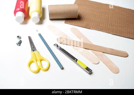 How to make airplane. Hand made toy,zero waste from toilet paper roll and popsicle sticks. For kids and parents. Step 1,materials. Stock Photo