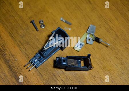 Disassembled vinyl player pickup with a rotary needle. Stock Photo