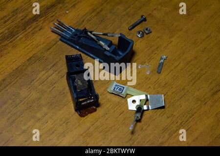 Disassembled vinyl player pickup with a rotary needle. Stock Photo