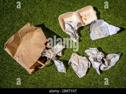 Discarded Fast Food Wrappers on Ground Stock Photo