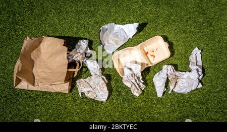 Discarded Fast Food Wrappers on Ground Stock Photo