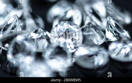 Small Diamonds on dark background as close up shot (selective focus) Stock Photo