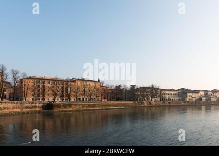 VERONA, ITALY - 14, MARCH, 2018: Wide angle picture of Adige River during autumn season in Verona, Italy Stock Photo