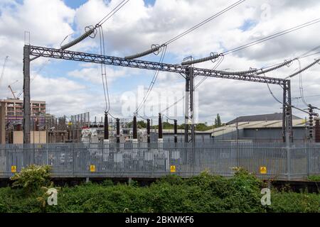 High voltage electrical cables and insulators in a power substation Stock Photo