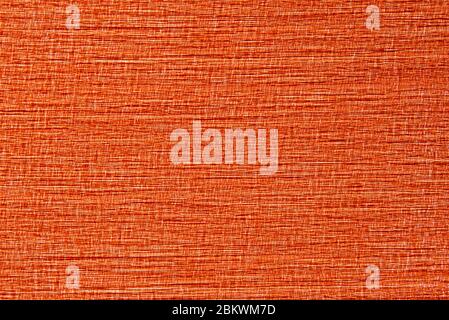 The texture of orange bright fabric made of interwoven threads, background Stock Photo