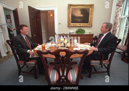 In this photo released by the White House, United States Senate Minority Leader Thomas Daschle (Democrat of South Dakota), left, has lunch with US President George W. Bush, right, in the President's private dining room off of the Oval Office of the White House in Washington, DC on on Monday January 29, 2001. Mandatory Credit: David Scull / White House via CNP / MediaPunch Stock Photo