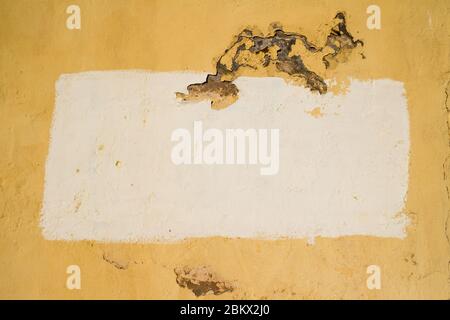 A painted area on a stucco background creating a frame with copy space. Stock Photo