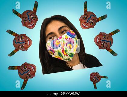 Young woman poses cheerfully with her chinstrap or mask. Positive attitude towards the coronavirus COVID 19 pandemic Stock Photo