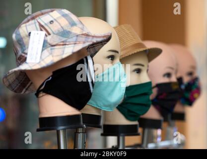 Brandenburg A.D.Havel, Germany. 30th Apr, 2020. Decorative dolls with hats and various mouth and nose protectors are set up in front of a tailor shop in the city centre. Credit: Soeren Stache/dpa-Zentralbild/ZB/dpa/Alamy Live News Stock Photo