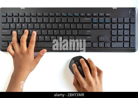 Hand on computer keyboard and mouse (wireless) isolated on white background Stock Photo