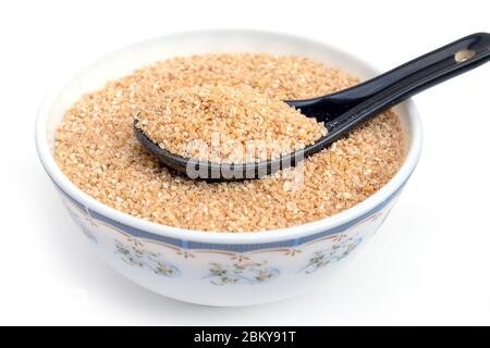 Bulgur (Daliya) in bowl, Bulgur wheat grains,  Raw cereal food, Dried cracked wheat. Stock Photo