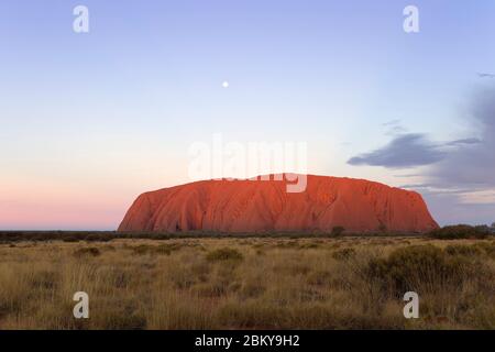 Moon rising over Uluru (Ayers Rock), Northern Territory, Australia Stock Photo