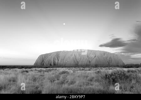 Moon rising over Uluru (Ayers Rock), Northern Territory, Australia Stock Photo