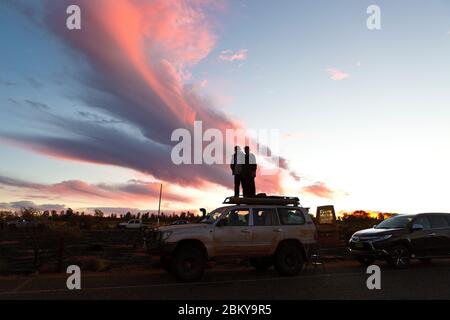 Tourists on a vehicle at the Uluru (Ayers Rock) sunset viewing car park, Northern Territory, Australia Stock Photo