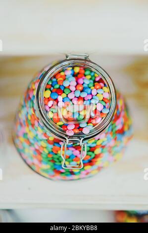 candys M & M's dispenser with them, all colours sweet Stock Photo