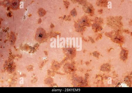 Bright rust stains texture paint showing through to rust underneath Stock Photo