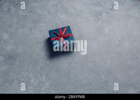 Creative Layout Christmas Gift Boxes., Flat lay Pattern On Grey Background. New Year Holidays Minimalism Concept Stock Photo