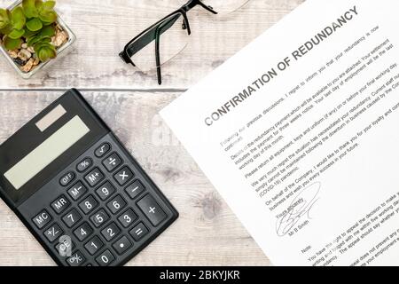 Economic recession - A redundancy letter and calculator. Stock Photo