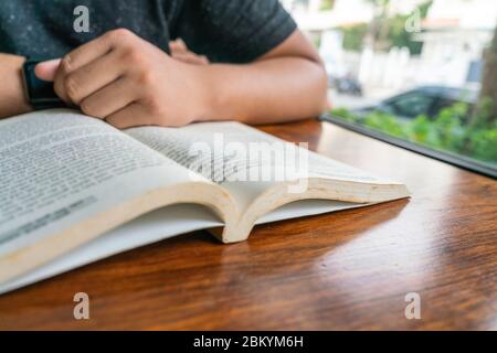 Close up photo of man reading book Stock Photo