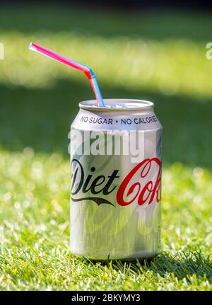 Open Can of Diet Coke with Plastic Straw, Diet Coke is made by The Coca-Cola Company and was first introduced in 1982 Stock Photo