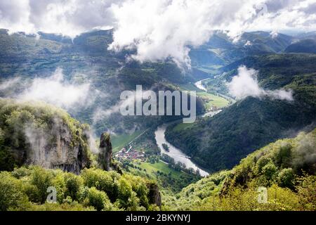 Kolpa river flowing through beautiful lush green landscape seen from a viewpoint Kozice, Slovenia Stock Photo
