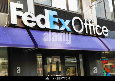 A Fedex logo seen on one of their branches.. Stock Photo