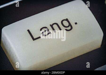 Extreme macro of a language button on a TV remote Stock Photo