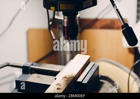 Drilling machine with laser sight in the workshop Stock Photo