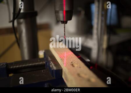 Drilling machine with laser sight in the workshop Stock Photo