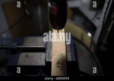 Drilling machine with laser sight in the workshop Stock Photo