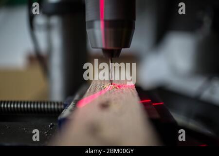 Drilling machine with laser sight in the workshop Stock Photo