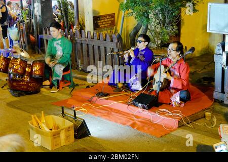 A group of blind musicians plays on a street in Hanoi (Vietnam) Stock Photo