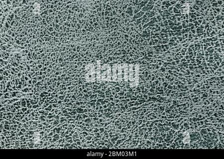 Dark gray background from a soft upholstery textile material, closeup. Matte green velvet fabric with natural texture. Cloth backdrop. Stock Photo