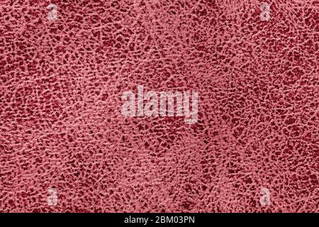 Dark red background from a soft upholstery textile material, closeup. Matte wine velvet fabric with natural texture. Cloth backdrop. Stock Photo