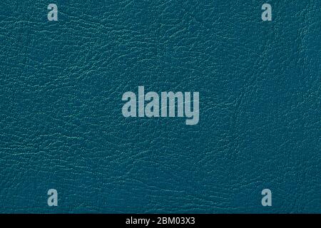 Dark navy blue leather texture background, closeup. Turquoise cracked backdrop from wrinkle skin, structure of textile. Stock Photo
