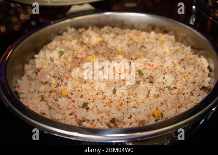 Asian style fried rice on a large buffet pan. Stock Photo