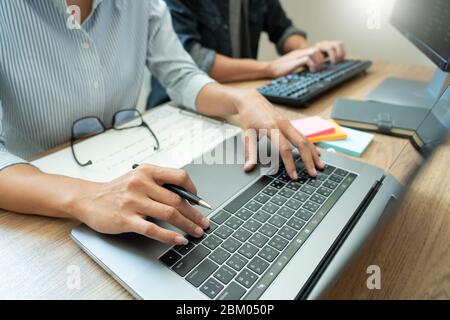 Collaborative work Software engineers website developer technologies or programmer working coding on startup ai application project on screen with par Stock Photo