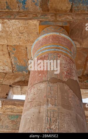 Hieroglypic carvings and paintings on columns at the ancient egyptian Karnak temple in Luxor Stock Photo