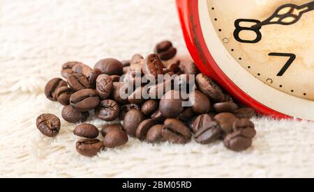 Good morning! Coffee beans and old vintage alarm clock close-up banner Stock Photo
