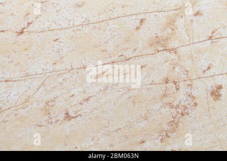 Texture of beige old marble material with cracked pattern, macro background. Structure of light brown and sand ancient stone, backdrop from mineral ti Stock Photo