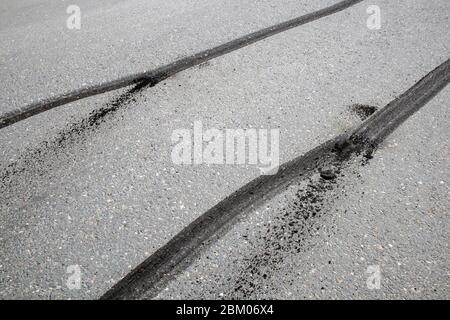 car tyre skid marks on road Stock Photo