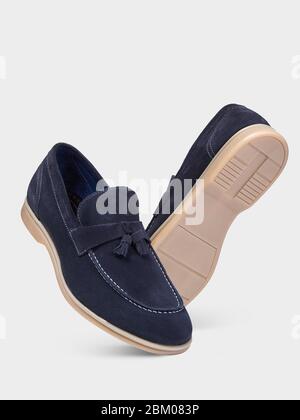 Men's summer suede blue loafers with laces and beige soles. isolated on a white background.Summer men's style. Men's classic style. Stock Photo