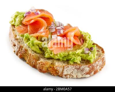 slice of bread with avocado and salmon isolated on white background Stock Photo