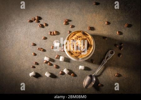 Homemade dalgona coffee. Trendy fluffy creamy whipped drink made by instant coffee, sugar and milk. Horizontal orientation Stock Photo