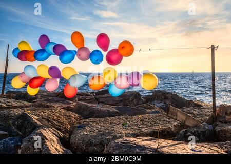 Colorful balloons on the string near the sea in Istanbul Stock Photo