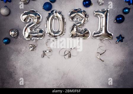 Golden Christmas 2021 balloons isolated on white background. Helium balloons, gold foil numbers. Numbers for Happy New Year 2021. Party decoration, an Stock Photo